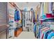 Organized walk-in closet with shelving, rods, and bench seating, providing ample storage for clothing and accessories at 444 Dornoch Dr., Pawleys Island, SC 29585