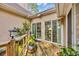 Charming wooden deck with outdoor decor and sliding glass doors to the interior, creating a seamless indoor-outdoor transition at 444 Dornoch Dr., Pawleys Island, SC 29585