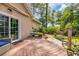 Outdoor deck with seating and garden area, perfect for relaxation and enjoying the surrounding greenery at 444 Dornoch Dr., Pawleys Island, SC 29585