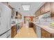 Contemporary kitchen featuring sleek stainless steel appliances and dark wood cabinets, creating a modern look at 444 Dornoch Dr., Pawleys Island, SC 29585