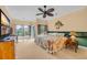 Spacious main bedroom with a decorative ceiling fan, multiple windows, and soft, neutral color scheme at 444 Dornoch Dr., Pawleys Island, SC 29585