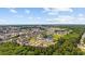 Aerial view showcasing the community near canals, lush landscapes, and distant city views at 4506 West Harbor Ct. # U-15, Little River, SC 29566