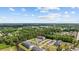 Aerial view of the community showing lush landscaping, a pool, and ample parking at 4506 West Harbor Ct. # U-15, Little River, SC 29566
