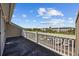 Spacious balcony offering scenic views of the landscaped community and parking area at 4506 West Harbor Ct. # U-15, Little River, SC 29566