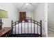Comfortable bedroom with a metal frame bed, side table, and soft, natural lighting at 4506 West Harbor Ct. # U-15, Little River, SC 29566