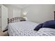 Cozy bedroom with a metal frame bed, side table with lamp, and a comfortable bed set at 4506 West Harbor Ct. # U-15, Little River, SC 29566