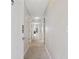 Neutral hallway with wall-to-wall carpet and a series of white paneled doors at 4506 West Harbor Ct. # U-15, Little River, SC 29566