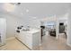 Bright, efficient kitchen area with white cabinetry and a view into the carpeted living area at 4506 West Harbor Ct. # U-15, Little River, SC 29566