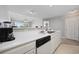 Clean kitchen area with white countertops and white cabinets, open to living space at 4506 West Harbor Ct. # U-15, Little River, SC 29566