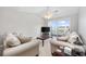 Bright living room featuring vaulted ceiling, comfortable seating, and sliding doors to a private balcony at 4506 West Harbor Ct. # U-15, Little River, SC 29566