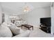 Comfortable living room area with two sofas, kitchen access and adjacent TV at 4506 West Harbor Ct. # U-15, Little River, SC 29566
