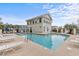 A refreshing community pool surrounded by lounge chairs and palm trees for relaxation at 4506 West Harbor Ct. # U-15, Little River, SC 29566
