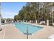 Relaxing pool surrounded by trees at 4506 West Harbor Ct. # U-15, Little River, SC 29566