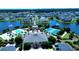 Aerial view showcasing the gated community featuring a community pool, tennis courts, and ponds at 451 W Palm Dr., Myrtle Beach, SC 29579