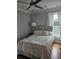 Cozy bedroom with a comfortable bed, hardwood floors, and soft lighting at 451 W Palm Dr., Myrtle Beach, SC 29579