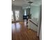 Bright entryway with wood floors, stairs, and glass doors leading to the outdoor porch at 451 W Palm Dr., Myrtle Beach, SC 29579