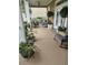 Inviting front porch features rocking chairs, plants, and ample seating for relaxing outdoors at 451 W Palm Dr., Myrtle Beach, SC 29579