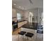 Modern kitchen showcasing granite countertops, stainless steel appliances, and a central island with bar seating at 451 W Palm Dr., Myrtle Beach, SC 29579