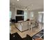 Spacious living room features a fireplace, tv and neutral decor at 451 W Palm Dr., Myrtle Beach, SC 29579