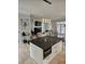 Open-concept kitchen and living room with island and ample seating at 451 W Palm Dr., Myrtle Beach, SC 29579