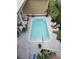 Overhead view of a backyard pool and outdoor seating area surrounded by lush landscaping at 451 W Palm Dr., Myrtle Beach, SC 29579