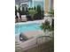 Relaxing pool area offers outdoor seating and beautiful plants, ideal for unwinding in style at 451 W Palm Dr., Myrtle Beach, SC 29579