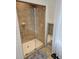 Modern shower with glass door, tile walls, and white mosaic tile floor at 451 W Palm Dr., Myrtle Beach, SC 29579