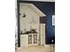 Charming wet bar with stylish shelving and fixtures at 451 W Palm Dr., Myrtle Beach, SC 29579