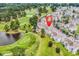 Aerial view showing the location of condos overlooking the green golf course and pond at 4705 Wild Iris Dr. # 305, Myrtle Beach, SC 29577