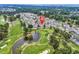 Scenic aerial view of a condo community on a golf course with water features and lush greenery at 4705 Wild Iris Dr. # 305, Myrtle Beach, SC 29577