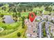 Condos on a golf course shown in aerial view with map marker over roofs at 4705 Wild Iris Dr. # 305, Myrtle Beach, SC 29577