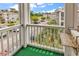 Balcony overlooking a parking lot and other condo buildings in the community at 4705 Wild Iris Dr. # 305, Myrtle Beach, SC 29577