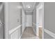 Hallway with tile flooring, light grey walls, and white trim at 4705 Wild Iris Dr. # 305, Myrtle Beach, SC 29577