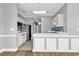 Open kitchen design featuring a breakfast bar, white cabinetry and modern appliances at 4705 Wild Iris Dr. # 305, Myrtle Beach, SC 29577