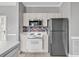 Bright kitchen featuring stainless steel appliances and white cabinets at 4705 Wild Iris Dr. # 305, Myrtle Beach, SC 29577