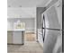 Bright kitchen with stainless steel appliances and a seamless flow into the living area at 4705 Wild Iris Dr. # 305, Myrtle Beach, SC 29577