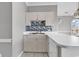 Open kitchen with breakfast bar, stainless steel sink and colorful backsplash at 4705 Wild Iris Dr. # 305, Myrtle Beach, SC 29577