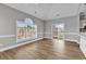 Bright living room with light-colored walls and wood floors with sliding door access at 4705 Wild Iris Dr. # 305, Myrtle Beach, SC 29577