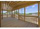 Wood-floored porch with wood railing and posts with an unobstructed view of the yard at 491 N Green Sea Rd., Loris, SC 29569