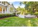 Serene backyard with a custom stone patio and fire pit, ideal for outdoor entertaining at 509 Heston Point Dr., Pawleys Island, SC 29585