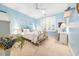 Serene bedroom with light blue walls, white furniture, a ceiling fan and bright natural light at 509 Heston Point Dr., Pawleys Island, SC 29585