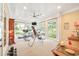 Bright exercise room featuring workout equipment and large windows offering natural light and scenic views at 509 Heston Point Dr., Pawleys Island, SC 29585