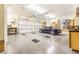 Spacious three-car garage with epoxy floor, car lift, and ample storage for vehicles and tools at 509 Heston Point Dr., Pawleys Island, SC 29585