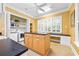 Multipurpose laundry room with storage, island, countertops and desk at 509 Heston Point Dr., Pawleys Island, SC 29585