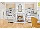 Cozy living room with a fireplace, built-in bookshelves, hardwood floors, and comfortable seating at 509 Heston Point Dr., Pawleys Island, SC 29585