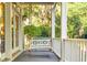 Inviting front porch featuring a classic swing, perfect for enjoying the outdoors at 509 Heston Point Dr., Pawleys Island, SC 29585