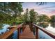 Scenic waterfront dock with wooden walkway, perfect for relaxation and water activities at 509 Heston Point Dr., Pawleys Island, SC 29585