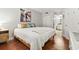 Bedroom with ensuite bathroom, hardwood floors, closet and artwork at 5523 North Ocean Blvd. # 1903, Myrtle Beach, SC 29577
