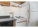 Kitchen area with white appliances and dark granite countertops at 5523 North Ocean Blvd. # 1903, Myrtle Beach, SC 29577
