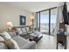 Comfortable living room with tile floors and balcony access offering picturesque ocean views at 5523 North Ocean Blvd. # 1903, Myrtle Beach, SC 29577